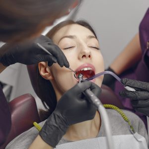 Beautiful girl sitting in the dentist's office